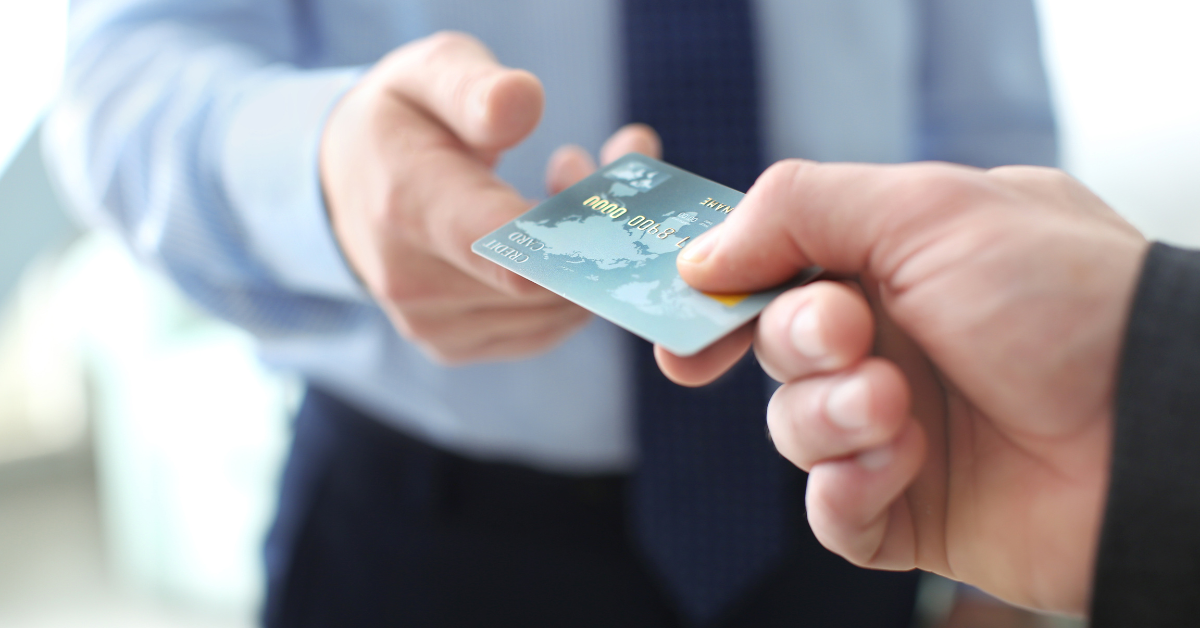 mental health therapy client handing over accepted insurance card
